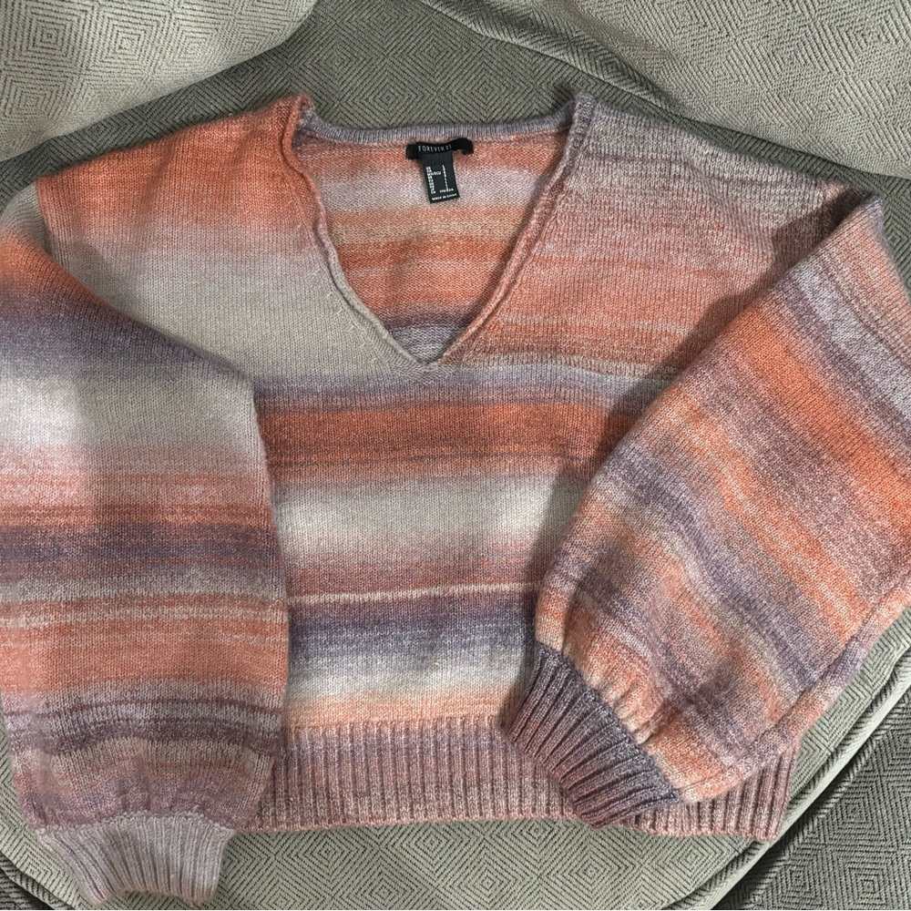 Cozy slightly cropped striped knit sweater.